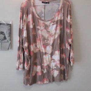 A tan and pink floral top